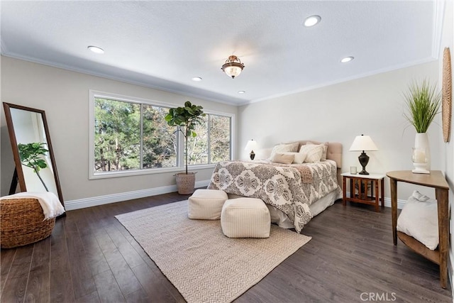 bedroom with dark hardwood / wood-style flooring and crown molding