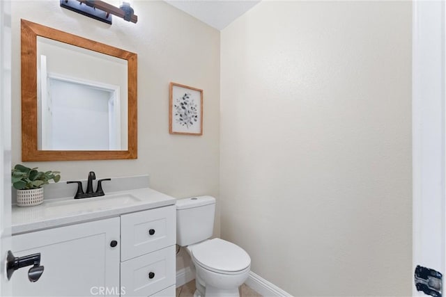 bathroom featuring toilet and vanity