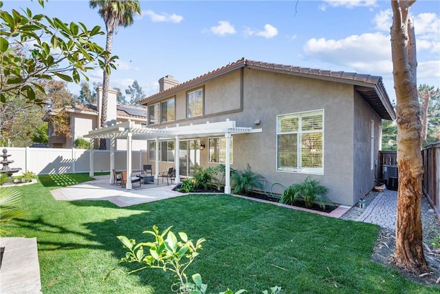 rear view of property with central AC unit, a pergola, a patio area, and a lawn