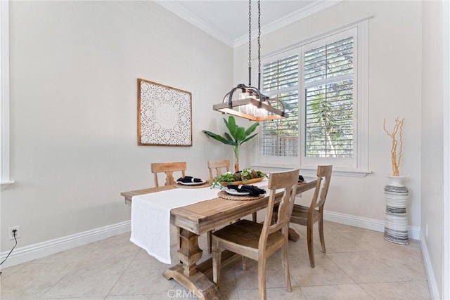 tiled dining area featuring crown molding