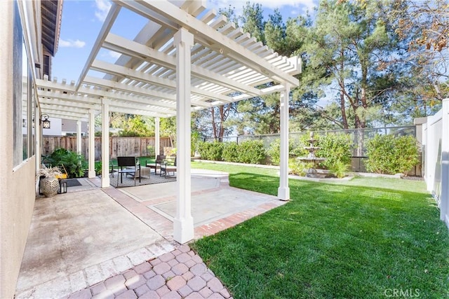 view of yard with a pergola and a patio area