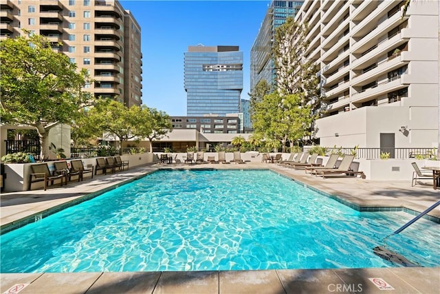 view of swimming pool with a patio