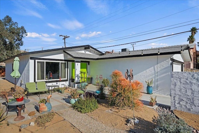 rear view of property with a patio area