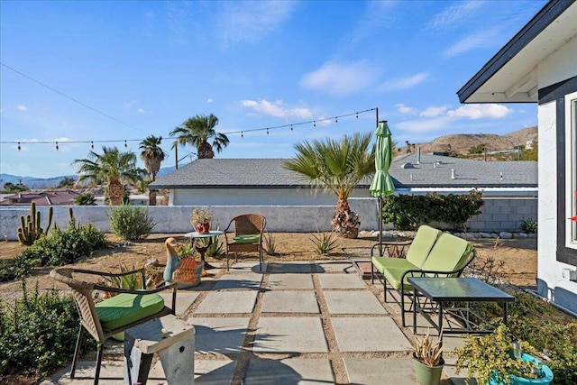 view of patio / terrace featuring a mountain view