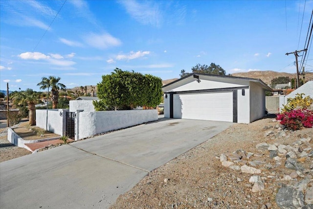 exterior space featuring a mountain view and a garage