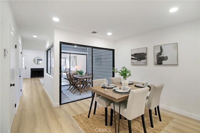 dining space featuring light hardwood / wood-style flooring