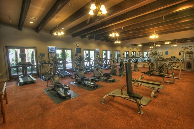 exercise room with an inviting chandelier