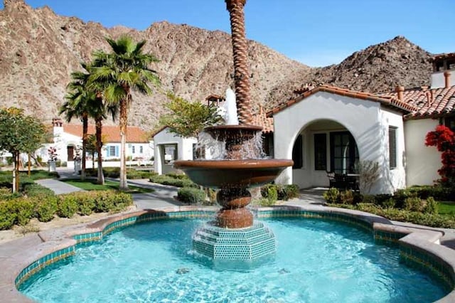 view of pool with a mountain view