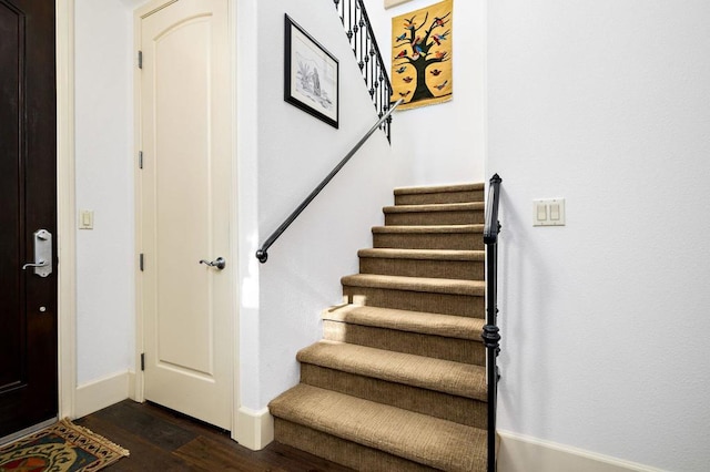 stairs with hardwood / wood-style flooring