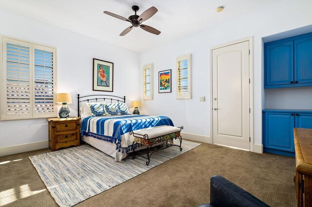 bedroom with ceiling fan and carpet flooring