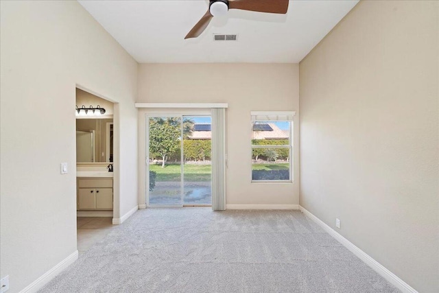 carpeted empty room with ceiling fan