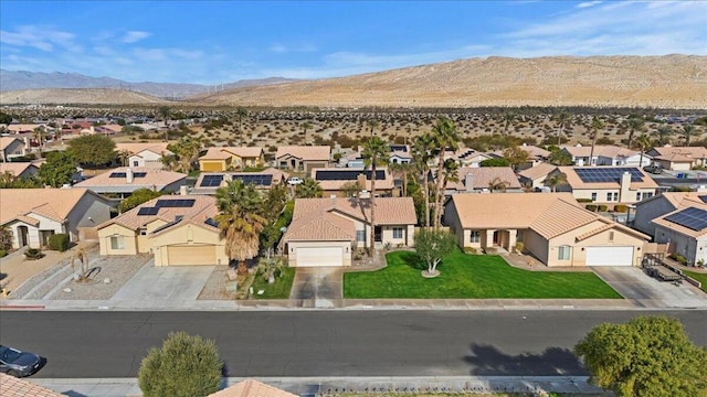 birds eye view of property featuring a mountain view