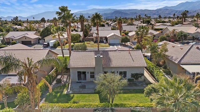 birds eye view of property featuring a mountain view