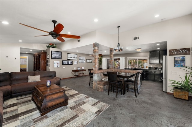 dining room with vaulted ceiling and ceiling fan