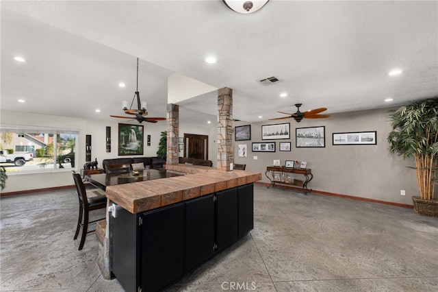 kitchen featuring ceiling fan and a large island