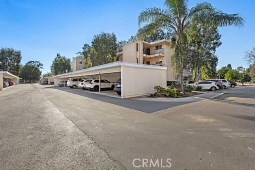 view of vehicle parking with a carport