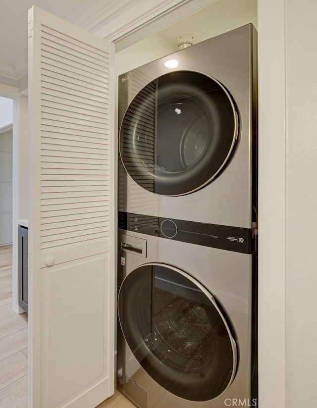 washroom with stacked washer / dryer