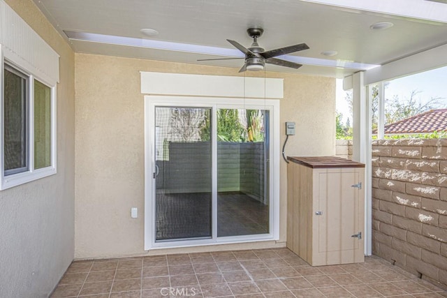 view of patio / terrace featuring ceiling fan