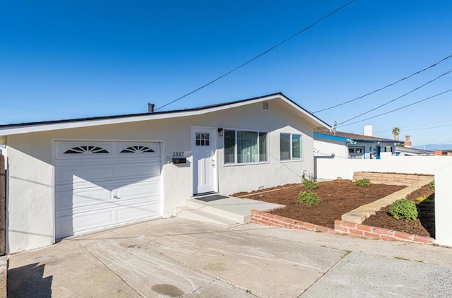 ranch-style home with a garage