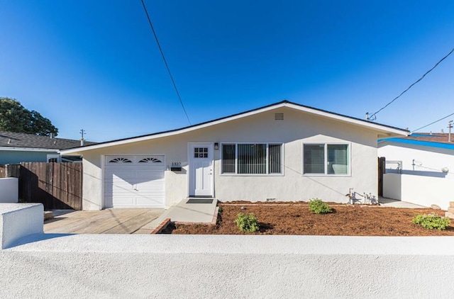 single story home with a garage