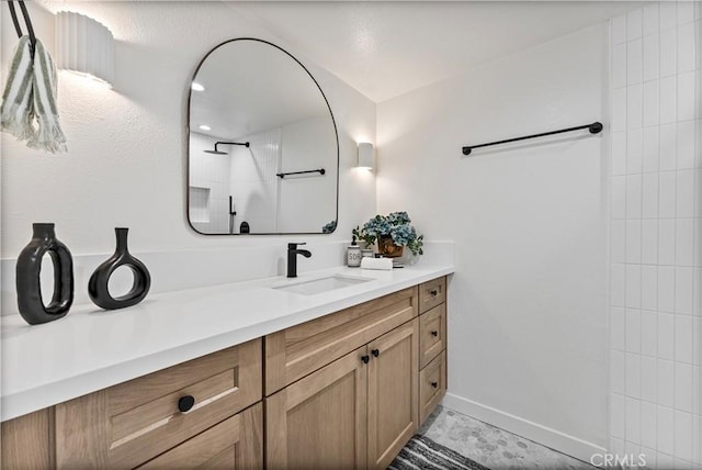 bathroom with a shower and vanity