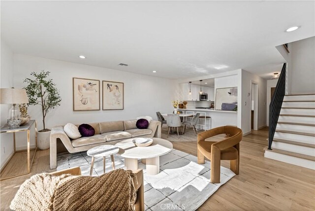 living room with light hardwood / wood-style floors