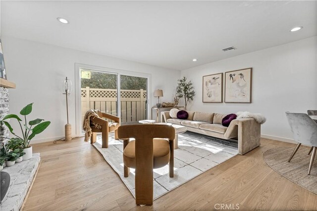 living room with light hardwood / wood-style floors