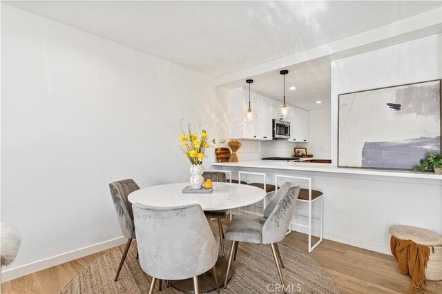 dining room featuring light hardwood / wood-style flooring