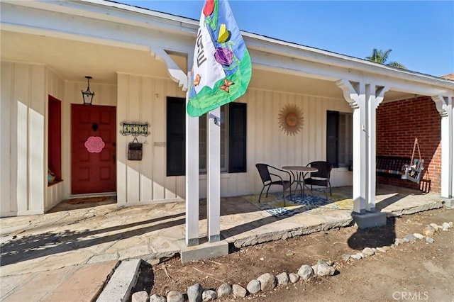 doorway to property featuring a porch