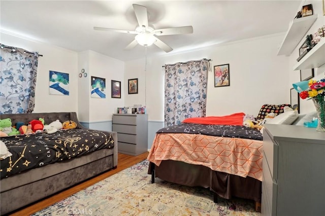 bedroom featuring ceiling fan and hardwood / wood-style floors