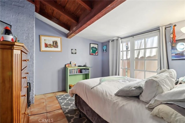 bedroom featuring light tile patterned floors, lofted ceiling with beams, and wooden ceiling