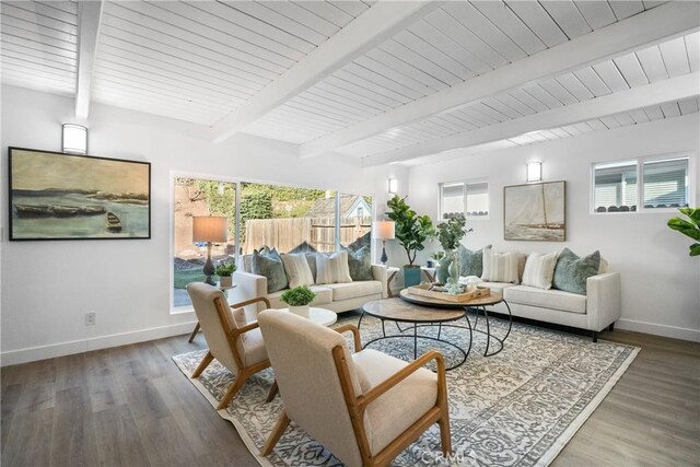 living room featuring hardwood / wood-style flooring, plenty of natural light, and beam ceiling