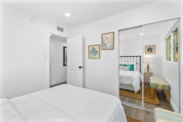 bedroom featuring a closet and wood-type flooring