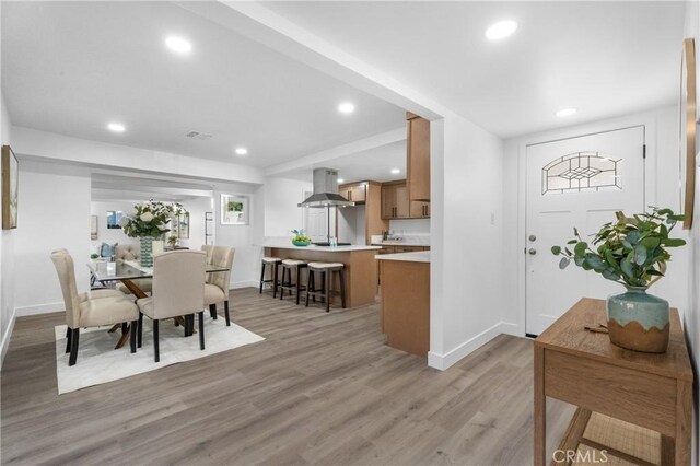 dining area with light hardwood / wood-style flooring