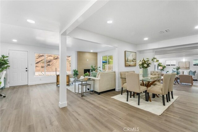 dining area featuring light wood-type flooring