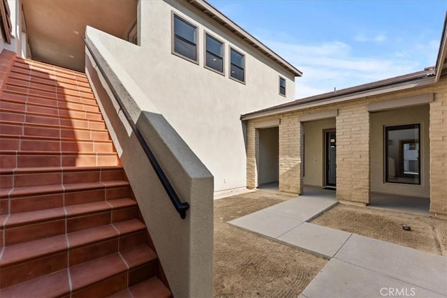 property entrance with a patio