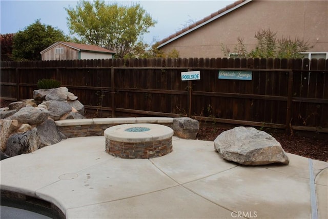 view of patio / terrace with a fire pit