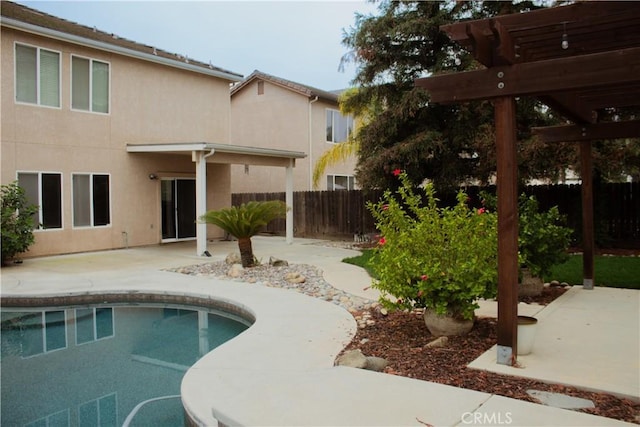 view of swimming pool featuring a pergola and a patio area