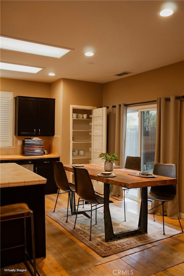 dining room with light hardwood / wood-style floors