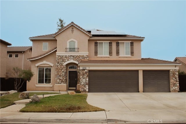 view of front of property with solar panels and a garage