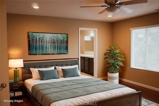 bedroom featuring ceiling fan, ensuite bathroom, and wood-type flooring