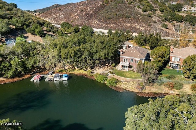 aerial view featuring a water and mountain view