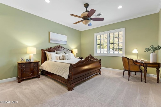 carpeted bedroom with ceiling fan and ornamental molding