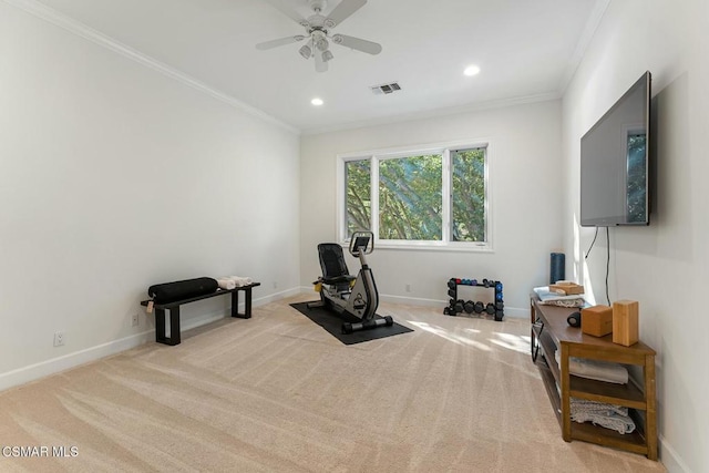 workout room with ornamental molding, ceiling fan, and light colored carpet