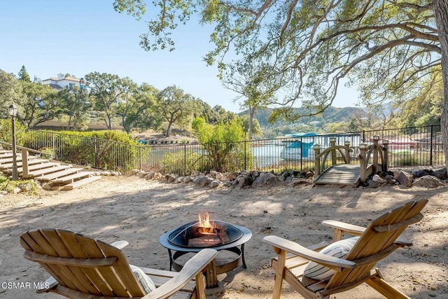 view of patio / terrace featuring an outdoor fire pit