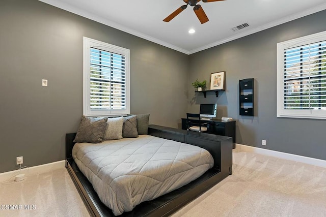 bedroom with crown molding, carpet flooring, and ceiling fan