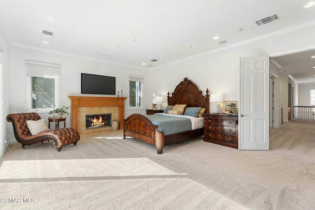 bedroom featuring crown molding and light carpet