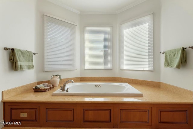 bathroom with a tub to relax in and ornamental molding