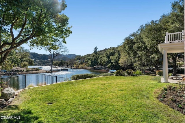 view of yard with a water and mountain view