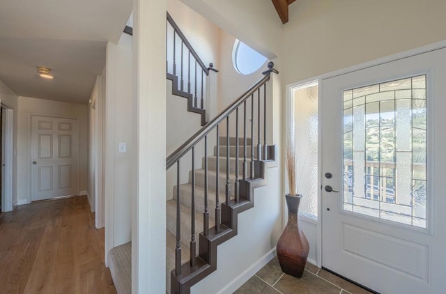 foyer featuring a healthy amount of sunlight and hardwood / wood-style floors